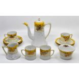 A Noritake coffee set circa pre WWII, yellow banding, with gilding, five tea cups and saucers with a
