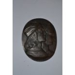 After Raphael E Fornarina, a bronze oval plaque depicting the bust of a lady and gentleman in 16th