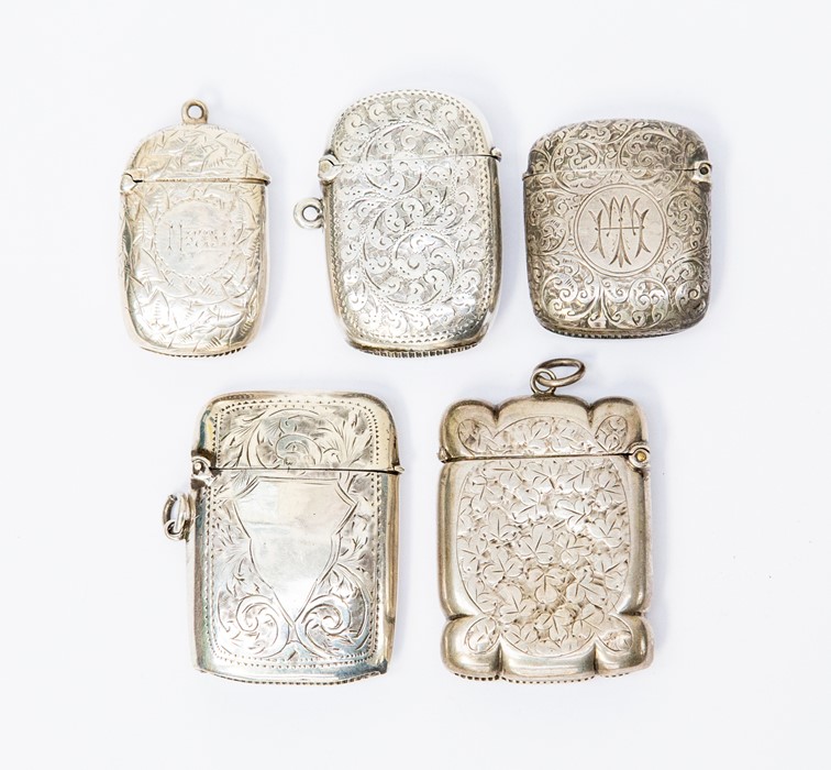 Four various Victorian silver vesta cases, each profusely engraved with foliage, flowers or scrolls,