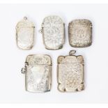 Four various Victorian silver vesta cases, each profusely engraved with foliage, flowers or scrolls,