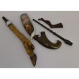A late 19th Century ceramic hand painted pipe depicting deer scene, plus a tamper (2)