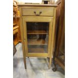 A 20th Century mahogany glazed music cabinet.