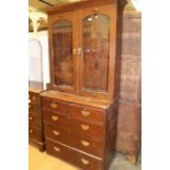 A glazed mahogany bookcase cabinet