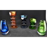 A pair of blue and green small glass vases along with three graduated coloured vases