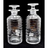 A pair of French, mid 20th Century decanters with stoppers