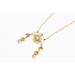 An Edwardian aquamarine and seed pearl 9ct gold pendant, the centre set with a round aquamarine with
