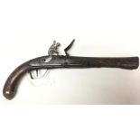 A Flintlock pistol with 25cm long barrel. Working action. No ramrod. Woodwork is covered with