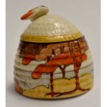 A Clarice Cliff honey pot with replacement lid