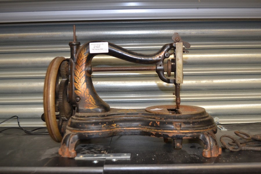 Small late 19th Century table top sewing machine Jones along with some old keys.