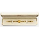 A ladies Zenith 9ct gold bracelet watch, boxed circa 1992 with guarantee, total gross weight 22gms