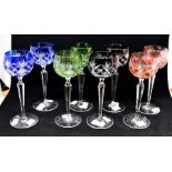 A set of eight early 20th Century German flashed coloured glass hock glasses on facet cut stem and