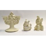 Poole Pottery white glaze bear, accordion player and a double candlestick, all marked to base