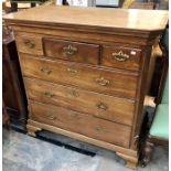 A George III mahogany chest of drawers, circa 1780, moulded cornice with carved reed pillars on