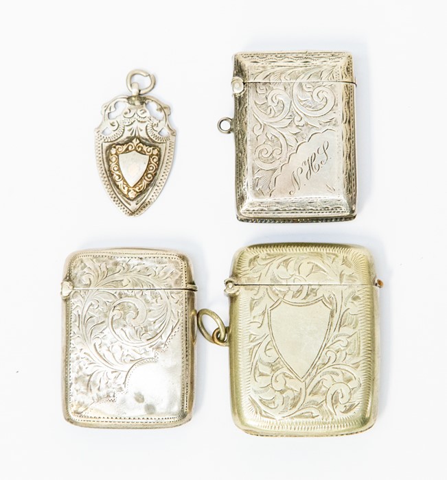 Two silver vesta cases; an EPNS vesta; and a silver fob medallion (4)