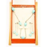 An 18ct white gold and turquoise type set necklace, comprising double link white gold chains with