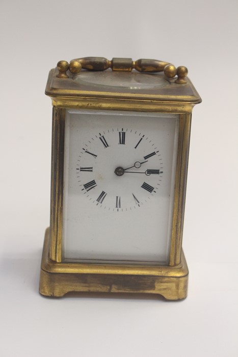 An early 20th Century brass carriage clock, in need of a clean, some damage, complete with key, - Image 4 of 4