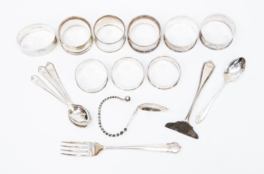 A collection of silver napkin rings and flat ware, mostly Birmingham silver 9 ozt approx