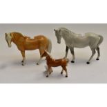 A collection of three horse figures to comprise: a Palomino mare and foal; together with a Beswick