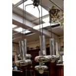 ** AUCTIONEER TO ANNOUNCE LOT WITHDRAWN ** A modern chrome hanging light fitting with four branches