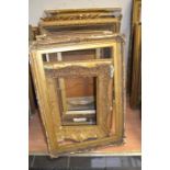 An extensive collection of large 19th Century Gesso-edged frames in various states of repair