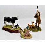 Three Border Fine Arts figure groups, including cattle breeds, Holstein Friesian cow and new calf,