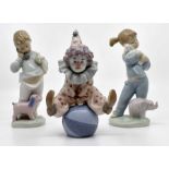 Lladro figure of a clown along with two Nao figures Condition: No obvious signs of damage or