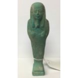 Ancient Egyptian Shabti figure. Blue glaze finish. 62mm in height. Width 47mm. The figure is in