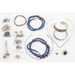 A collection of silver and white metal jewellery to include lapis lazuli set jewellery including