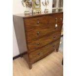 An early 19th Century Georgian two over three chest of mahogany drawers, with brass handles on