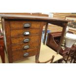 A 20th Century oak and mahogany inlay desk, gallery back on a rectangular top, above five