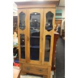 Early 20th century pitch pine display cabinet, glazed, three internal shelves, drawer in base with