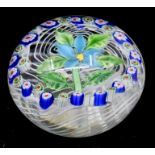 A mid 20th Century paperweight with blue floral design Condition: No obvious signs of damage or