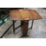 A 20th Century oak small dropleaf table.