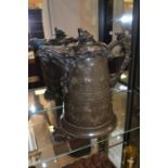 A late 19th Century American coffee pot in pewter, with an eagle spout design