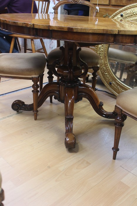 A Victorian style burr walnut floral oval shape tilt top table, octagonal column with reverse carved - Image 2 of 2