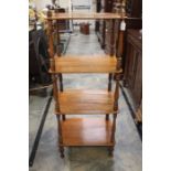 A Victorian mahogany four tier whatnot on turned supports