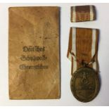 WW2 Third Reich Deutsches Schutzwall-Ehrenzeichen. West Wall Medal. Early Tombak example. Complete