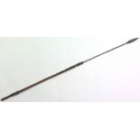 An 19th Century African Spear with steel shaft, 14cm point, overall length 128cm. Steel bound wood