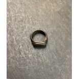 Roman Bronze Ring. Circa 4th century. A bronze ring with an elliptical-shaped bezel, a thick rib