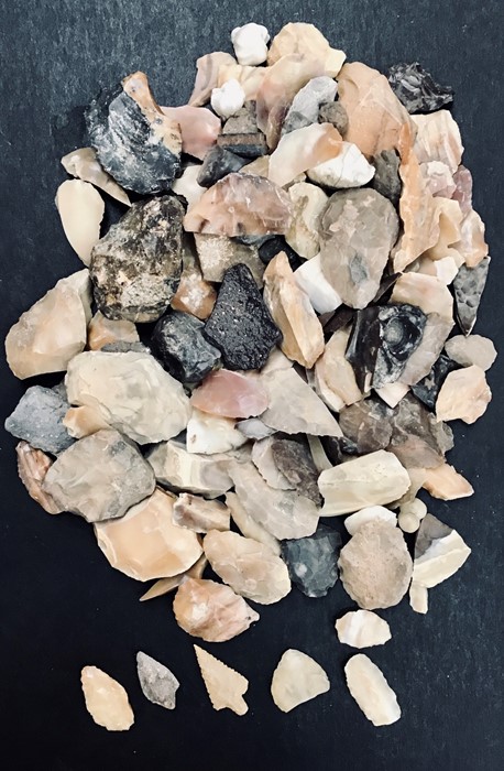 Collection of North African Flint Arrow Heads. A bag of flint arrowheads and other pieces of flint