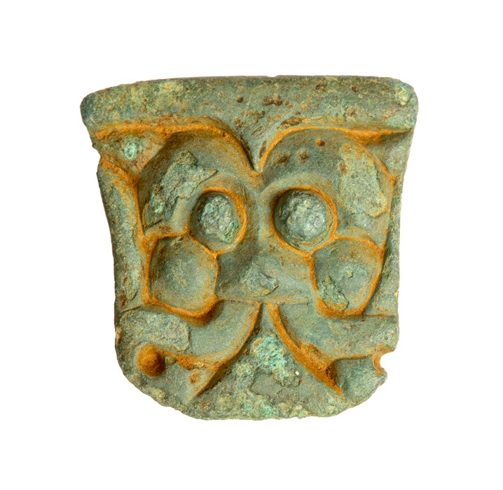 Early Anglo-Saxon Stylised Face Mount. A detachable side knop from a florid cruciform brooch