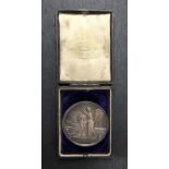 An Edwardian silver photograph medal "Presented to J J Rothwell of Focus, by Douglas Clock Co.,