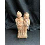 A terracotta/earthenware figure group. (11cm high, 6.5cm wide)