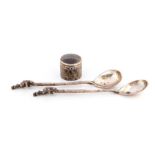 A pair of Russian 'tea holder' silver spoons, the stems cast naturalistically with bears climbing