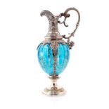 An ornate early 20th Century German WMF Claret Jug, silver plated detail showing embossed foliate