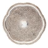 An early 20th Century Indian silver server, embossed floral decoration, diameter approx. 28cm,