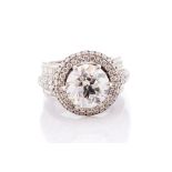 An impressive diamond solitaire 18ct white gold ring, the centre round brilliant-cut stone approx