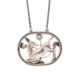 Georg Jensen - a Danish silver pendant, no. 95, Kneeling Deer, approx 4.5cm wide, suspended on a