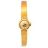 Omega - an 18ct gold ladies Omega Ladymatic wristwatch, round gold tone dial, approx. 13mm, baton