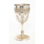 A late Victorian large silver goblet, the body chased with a pelmet band of scrolling foliage